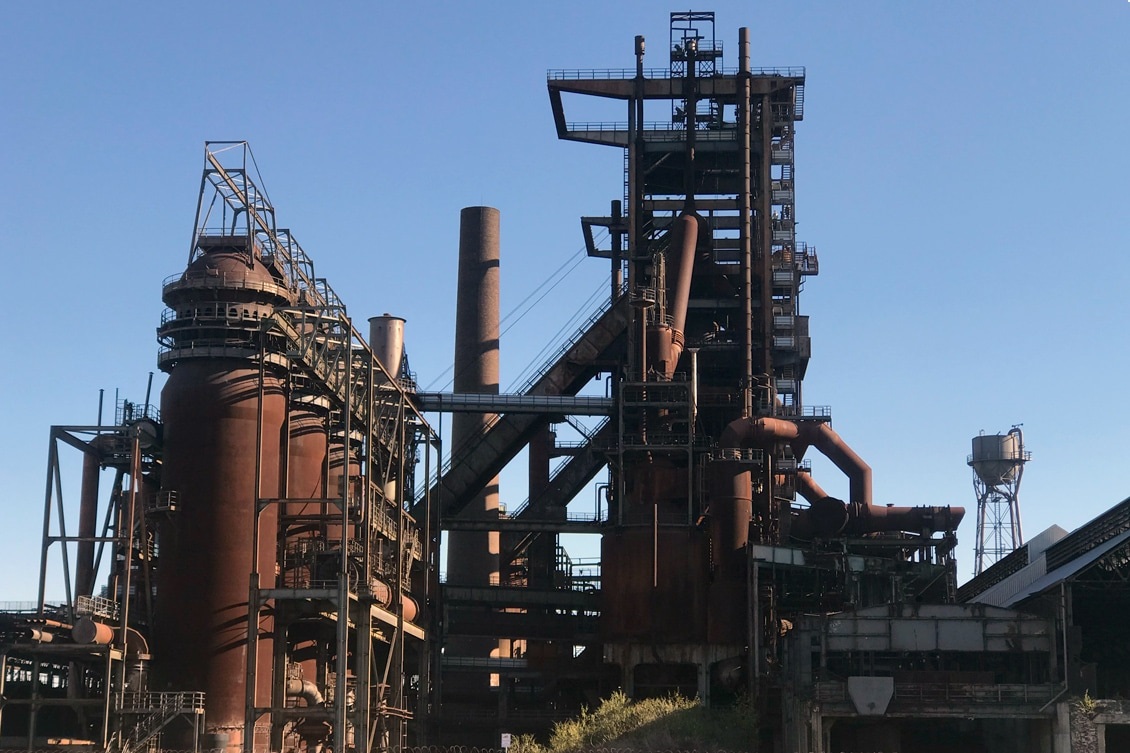 technician operating combustion equipment during furnace startup